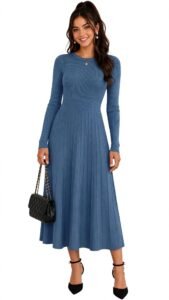 Dusty blue long-sleeve midi dress with a camel coat for a daytime winter wedding