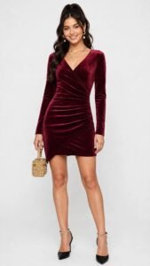 Red velvet mini dress styled with black tights and boots for a Christmas party
